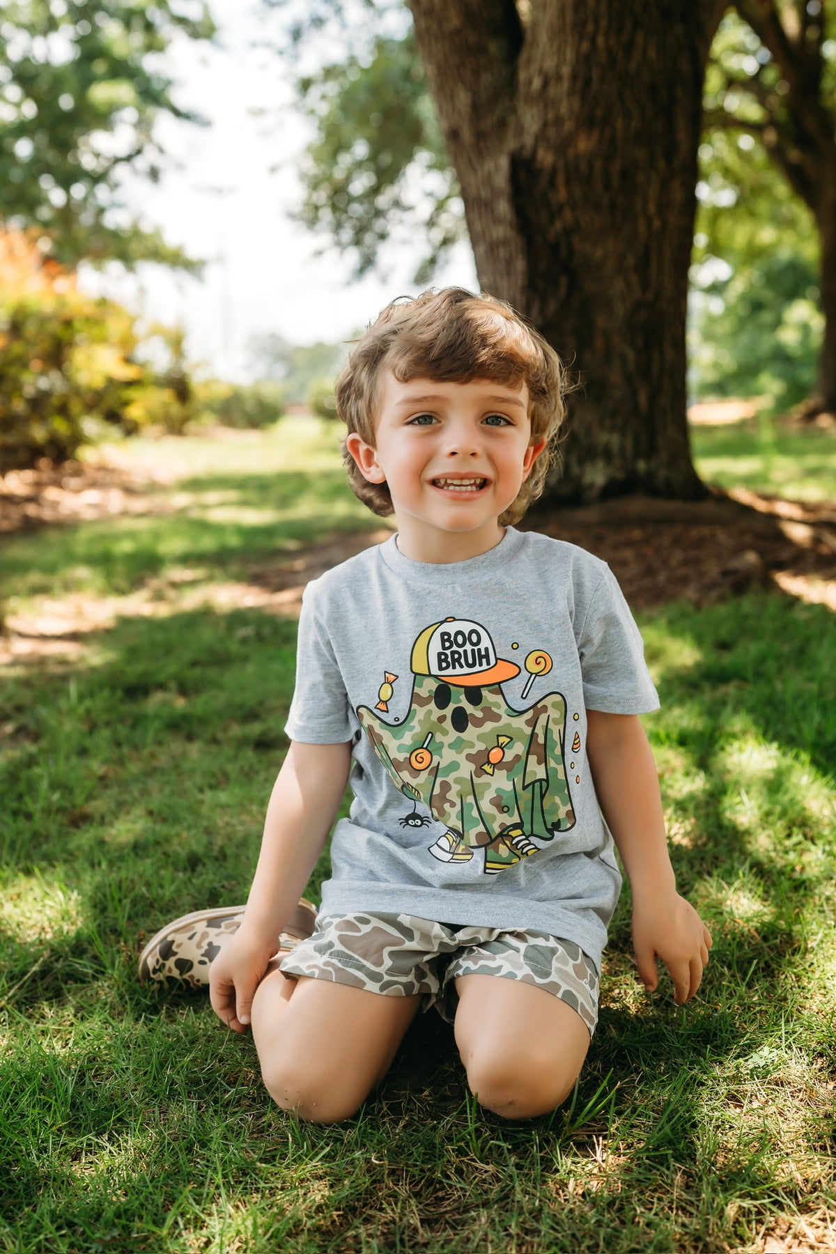 Boo Bruh Halloween tee on a smiling child outdoors